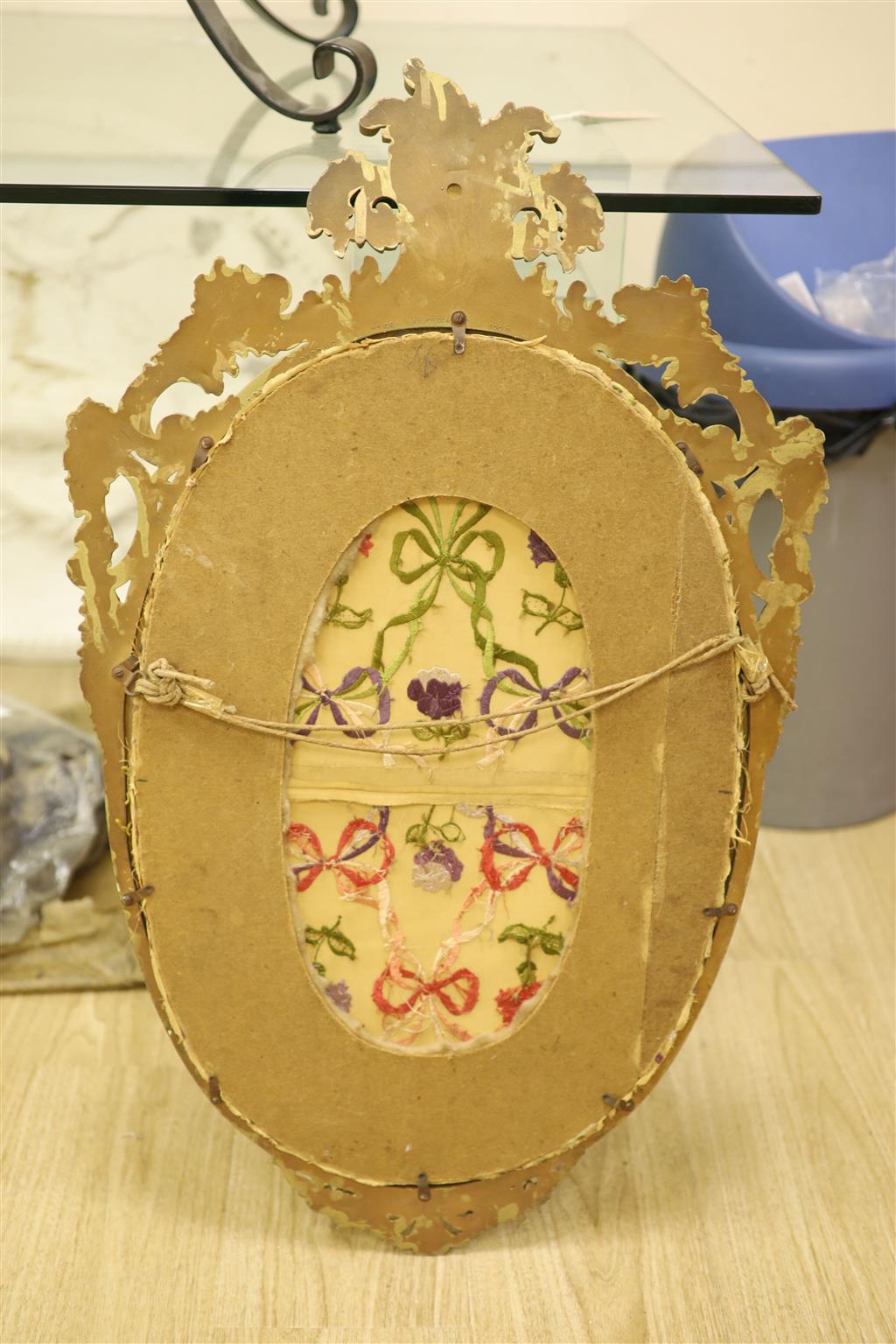 An oval needlework panel and another, largest 39 x 59cm